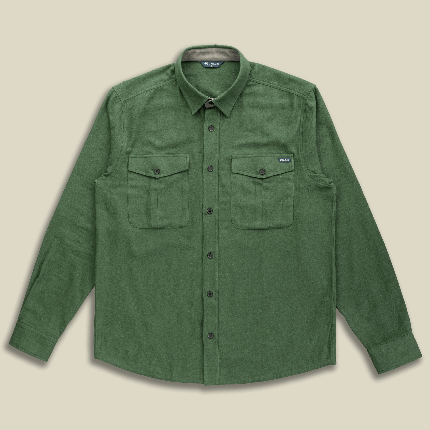 Green shirt with two front pockets on a beige background