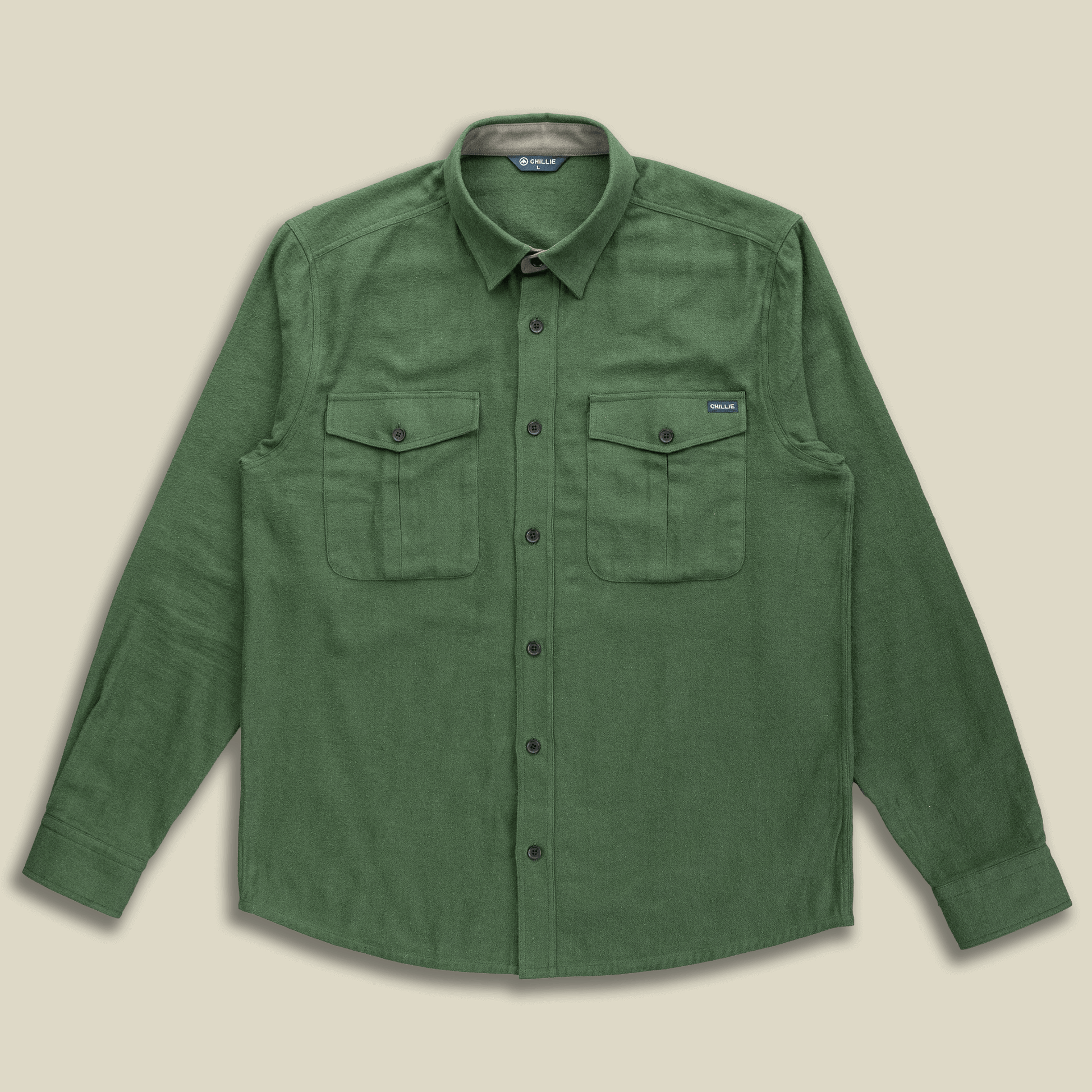 Green shirt with two front pockets on a beige background